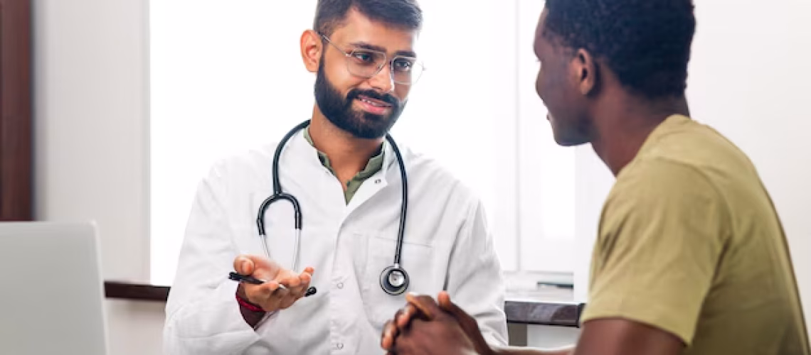 indian-doctor-therapist-white-coat-consulting-supporting-patient-modern-clinic-hospital_175356-12278